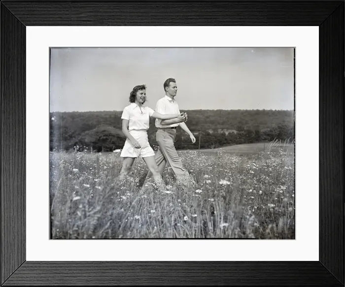 Framed Print : Couple Walking Through Flower Field Framed Print : Couple Walking Through Flower Field