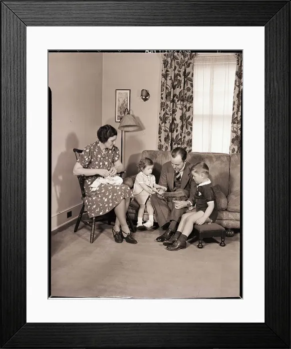 Framed Print : Family Sitting in Living Room Framed Print : Family Sitting in Living Room