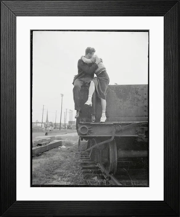 Framed Print : Young Couple Kissing on Railroad Car Framed Print : Young Couple Kissing on Railroad Car