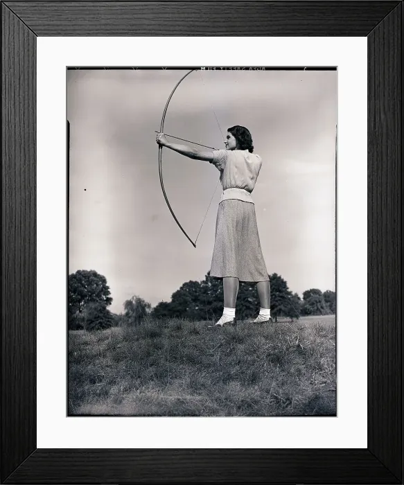 Framed Print : Woman Aiming Bow and Arrow Framed Print : Woman Aiming Bow and Arrow