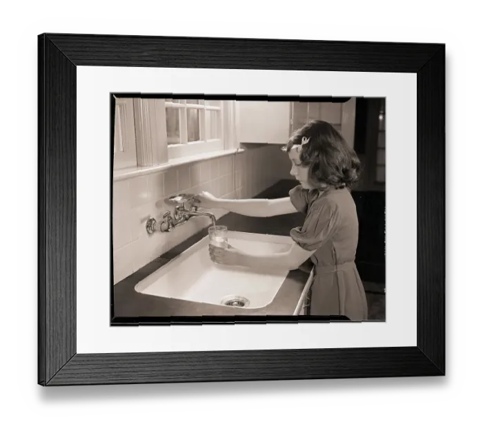 Framed Print : Girl Filling Glass with Water Framed Print : Girl Filling Glass with Water