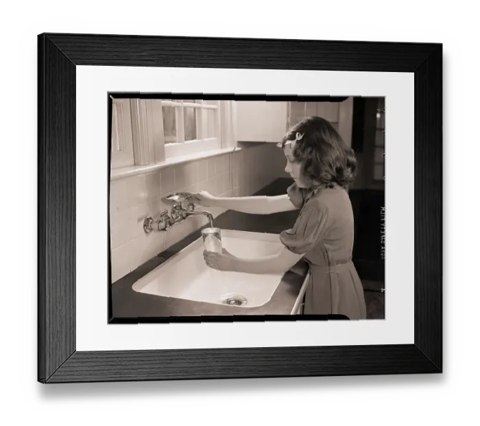 Framed Print : Girl Filling Glass with Water Framed Print : Girl Filling Glass with Water