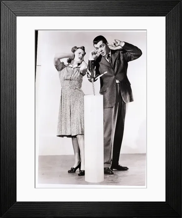 Framed Print : Man and Woman Pose with Giant Firecracker Framed Print : Man and Woman Pose with Giant Firecracker