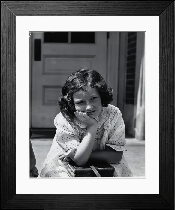 Framed Print : Schoolgirl Sitting with Books in Lap Framed Print : Schoolgirl Sitting with Books in Lap
