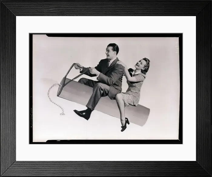 Framed Print : Couple Riding Fake Stick Of Dynamaite Framed Print : Couple Riding Fake Stick Of Dynamaite