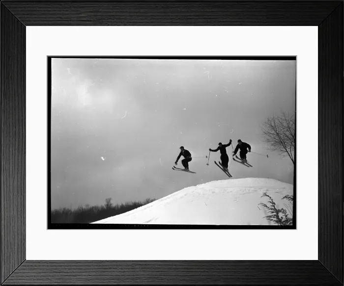 Framed Print : Three Skiers Caught In Air As They Ski Framed Print : Three Skiers Caught In Air As They Ski