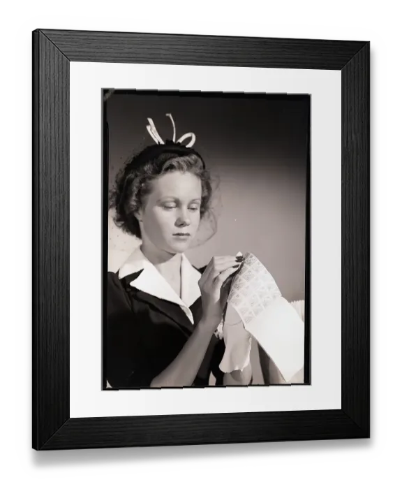 Framed Print : Woman Tearing Coupon Out Of Ration Book Framed Print : Woman Tearing Coupon Out Of Ration Book