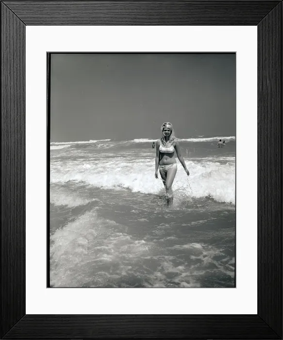 Framed Print : Woman Walks Out Of Ocean Surf Framed Print : Woman Walks Out Of Ocean Surf