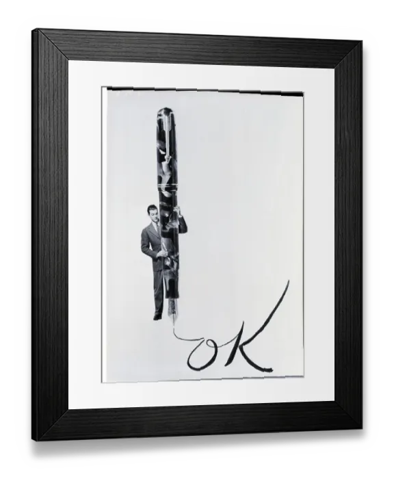 Framed Print : Man With Giant Pen Writing Ok Framed Print : Man With Giant Pen Writing Ok