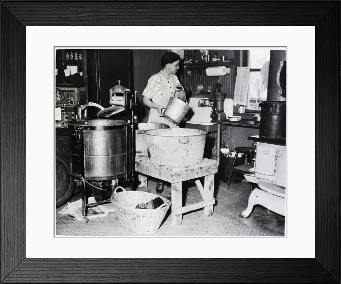 Framed Print : Housewife Is Shown Pumping Water In Kitc Framed Print : Housewife Is Shown Pumping Water In Kitc