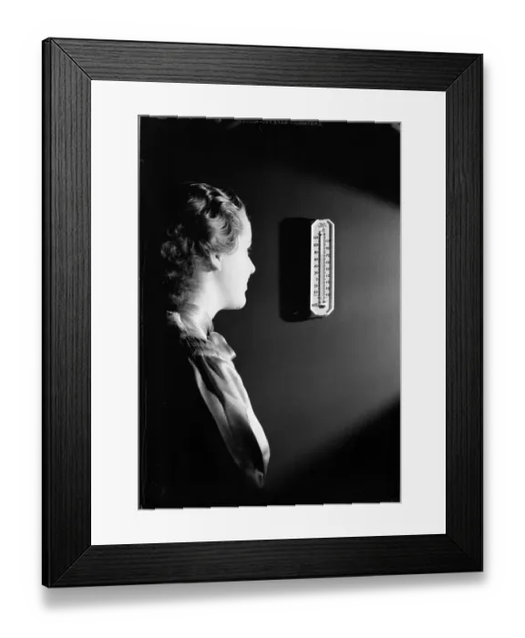 Framed Print : Woman Looking at Thermometer Framed Print : Woman Looking at Thermometer