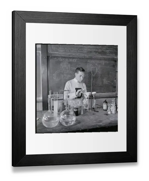 Framed Print : Student Doing Experiment in Laboratory Framed Print : Student Doing Experiment in Laboratory