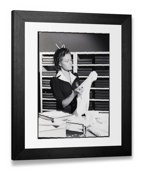 Framed Print : Woman Shopper Examining Towel Framed Print : Woman Shopper Examining Towel