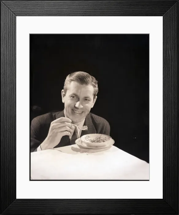 Framed Print : Man in Suit Eating Bowl of Cereal Framed Print : Man in Suit Eating Bowl of Cereal