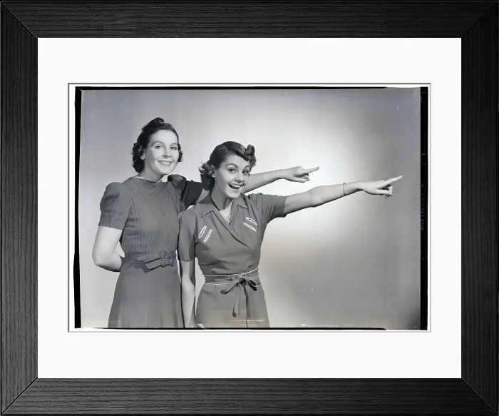 Framed Print : Two Smiling Women Pointing Framed Print : Two Smiling Women Pointing