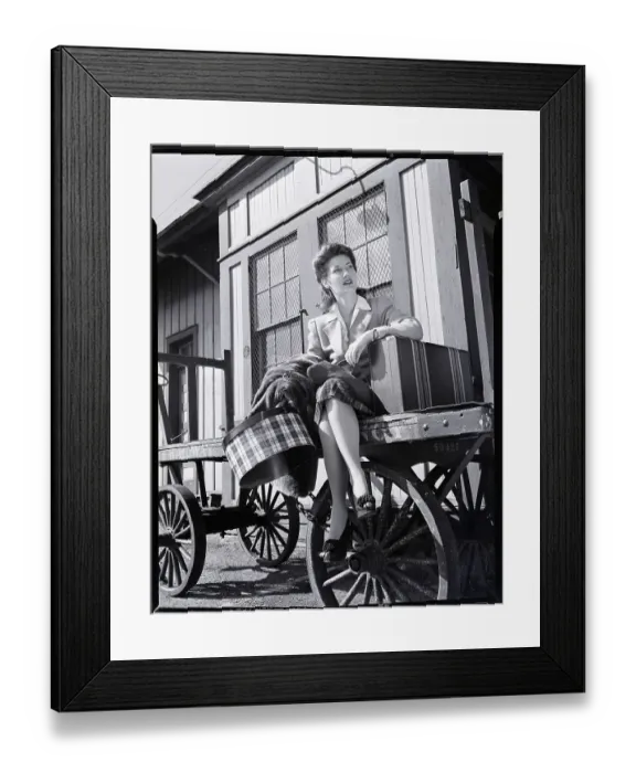 Framed Print : Woman Sitting on Luggage Trolley Framed Print : Woman Sitting on Luggage Trolley