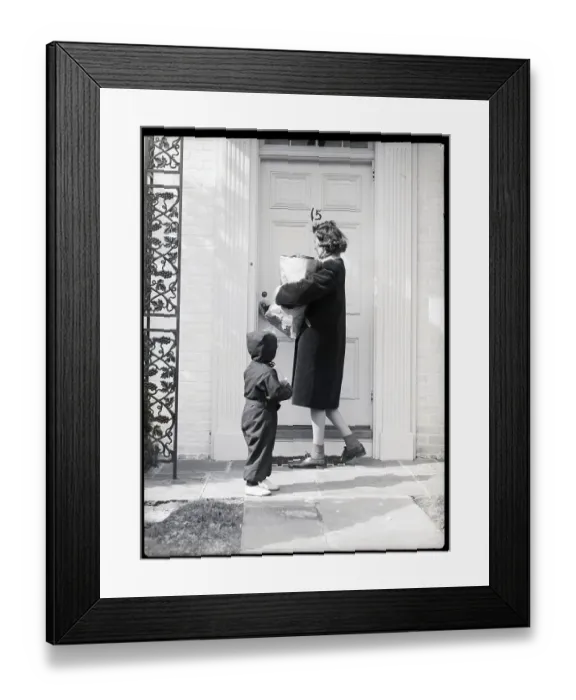 Framed Print : Woman Holding Groceries and Child Enter House Framed Print : Woman Holding Groceries and Child Enter House