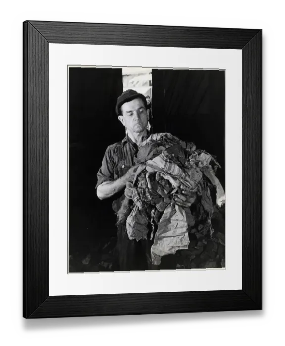 Framed Print : Man Holding Torn Fabric Scraps Framed Print : Man Holding Torn Fabric Scraps