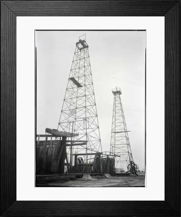 Framed Print : Two Oil Derricks And Pumping Rigs Framed Print : Two Oil Derricks And Pumping Rigs