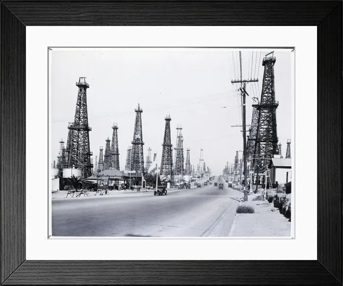 Framed Print : Wooden Oil Derricks Surrounding Road Framed Print : Wooden Oil Derricks Surrounding Road