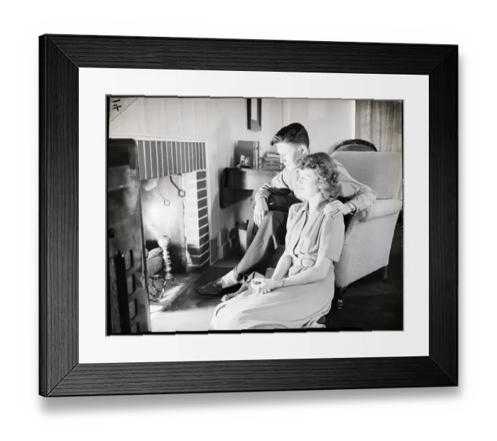 Framed Print : Teenage Couple Sitting Near Fireplace Framed Print : Teenage Couple Sitting Near Fireplace