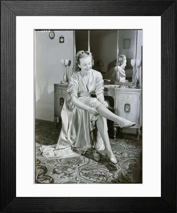 Framed Print : Woman Putting On Stockings Framed Print : Woman Putting On Stockings
