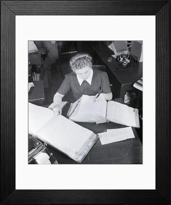 Framed Print : Female Office Worker Writing In Book Framed Print : Female Office Worker Writing In Book