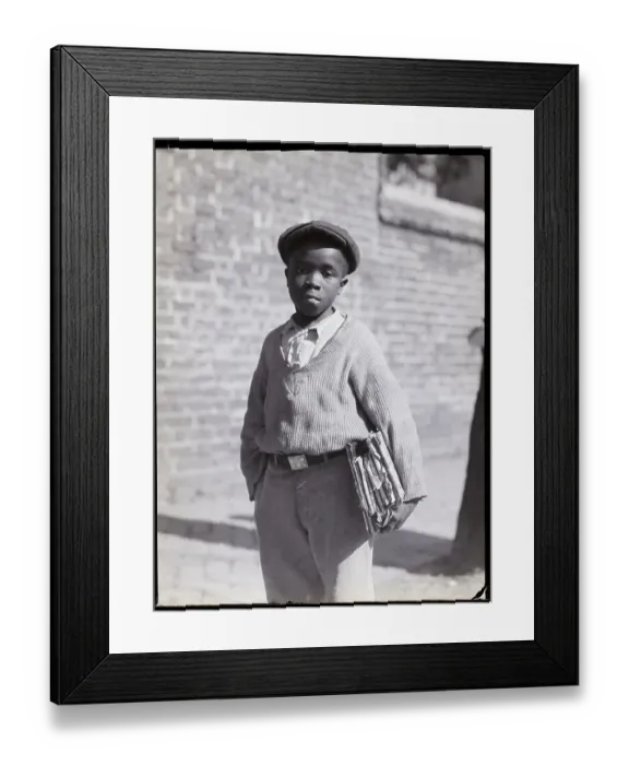 Framed Print : African American Schoolboy with Books Under Arm Framed Print : African American Schoolboy with Books Under Arm
