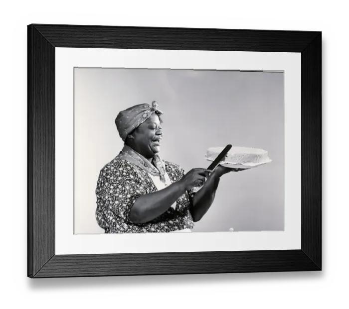 Framed Print : Woman in Mammy Costume Frosting Cake Framed Print : Woman in Mammy Costume Frosting Cake