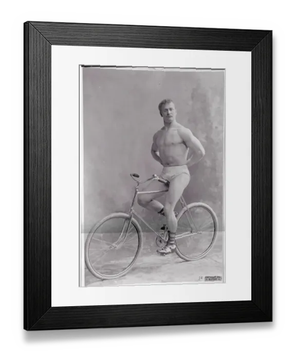 Framed Print : Strongman Sitting on Bicycle Framed Print : Strongman Sitting on Bicycle