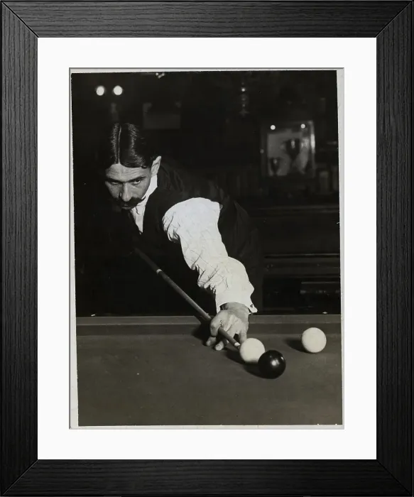 Framed Print : Man Shooting Pool Aimimg At Ball