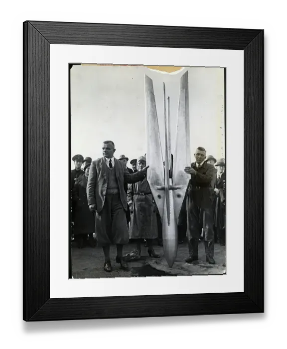 Framed Print : Two Men Hold up a Rocket Framed Print : Two Men Hold up a Rocket