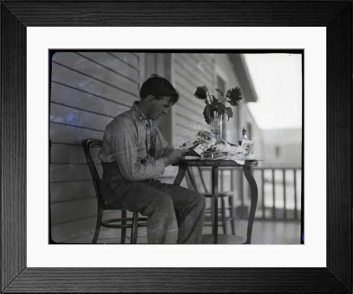 Framed Print : Battling Nelson Seated at Table Reading Cards Framed Print : Battling Nelson Seated at Table Reading Cards