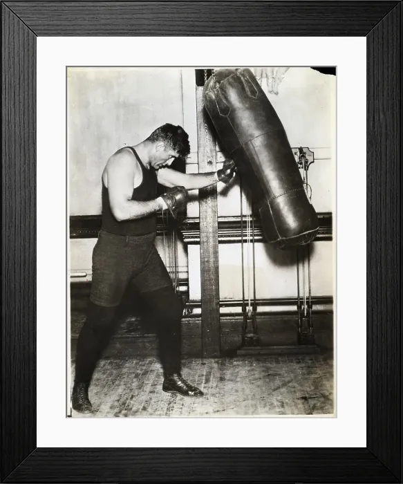 Framed Print : Full Length Jess Willard Punches Bag