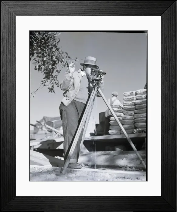 Framed Print : Surveyor Looking Through Instrument Framed Print : Surveyor Looking Through Instrument