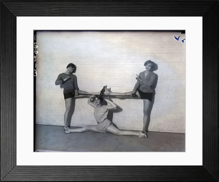 Framed Print : Three Women In Stretch-Pose In Gymnasium Framed Print : Three Women In Stretch-Pose In Gymnasium