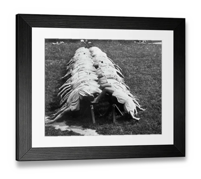 Framed Print : Row Of Women Doing Backbend Over Bench Framed Print : Row Of Women Doing Backbend Over Bench