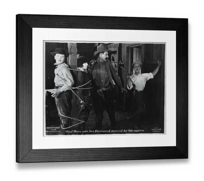 Framed Print : Small Cowboy Catches Large Cowboy