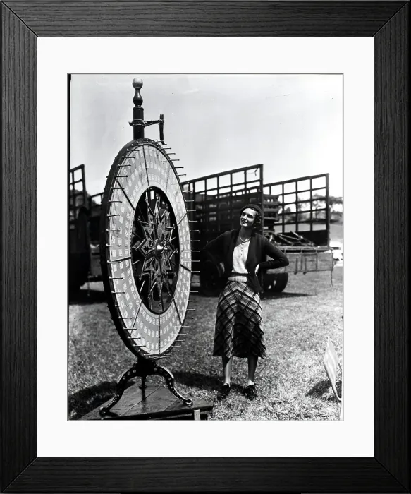 Framed Print : Woman Standing Near Wheel Of Fortune Framed Print : Woman Standing Near Wheel Of Fortune