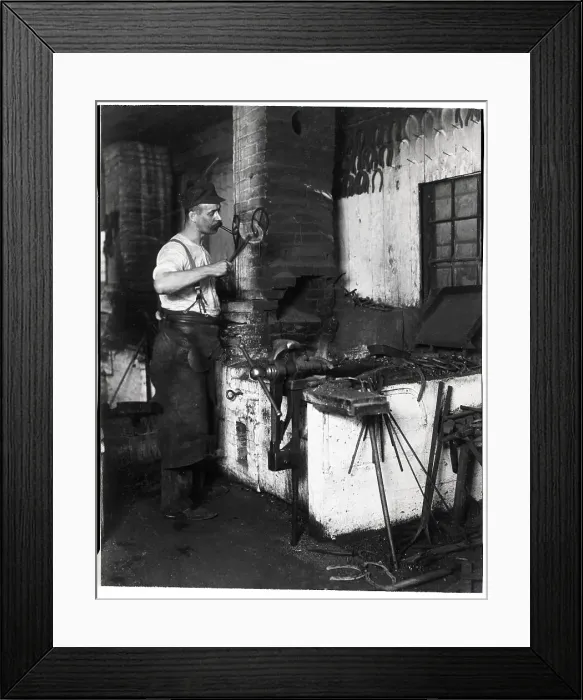 Framed Print : Blacksmith Lights Cigar W / Hot Horseshoe Framed Print : Blacksmith Lights Cigar W / Hot Horseshoe