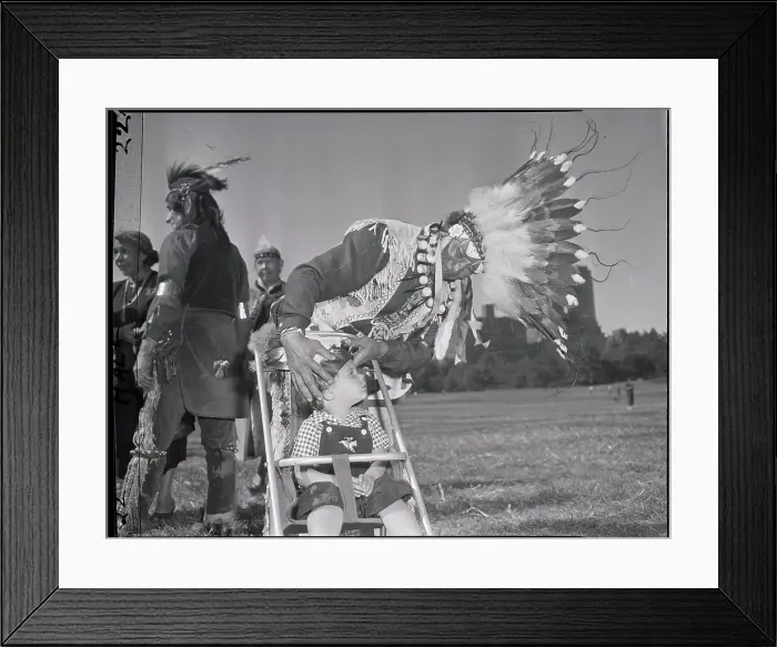 Framed Print : Indian Chief Places Bonnet On Baby'S Head Framed Print : Indian Chief Places Bonnet On Baby'S Head