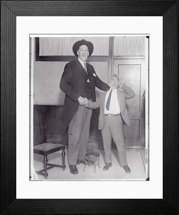 Framed Print : Tall Man Shaking Hand of Friend Framed Print : Tall Man Shaking Hand of Friend
