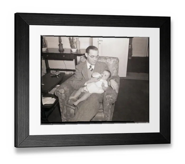 Framed Print : Benny Goodman Feeding Baby Framed Print : Benny Goodman Feeding Baby