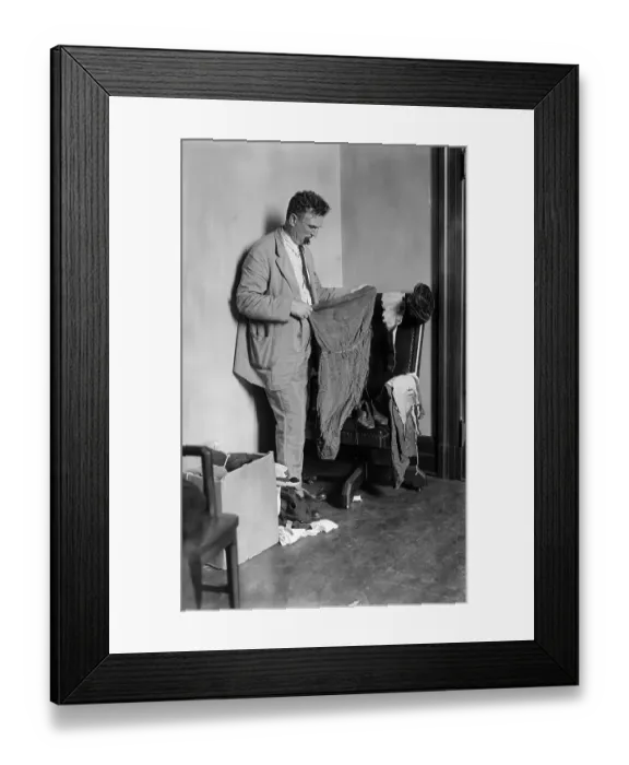 Framed Print : Detective Examining Clothing of Murder Victims Framed Print : Detective Examining Clothing of Murder Victims