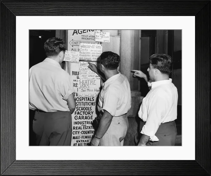 Framed Print : Men Look At Job Postings At Agency