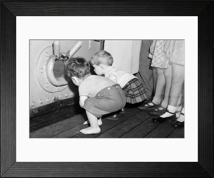 Framed Print : Toddlers Gazing Through Porthole On Ship Framed Print : Toddlers Gazing Through Porthole On Ship