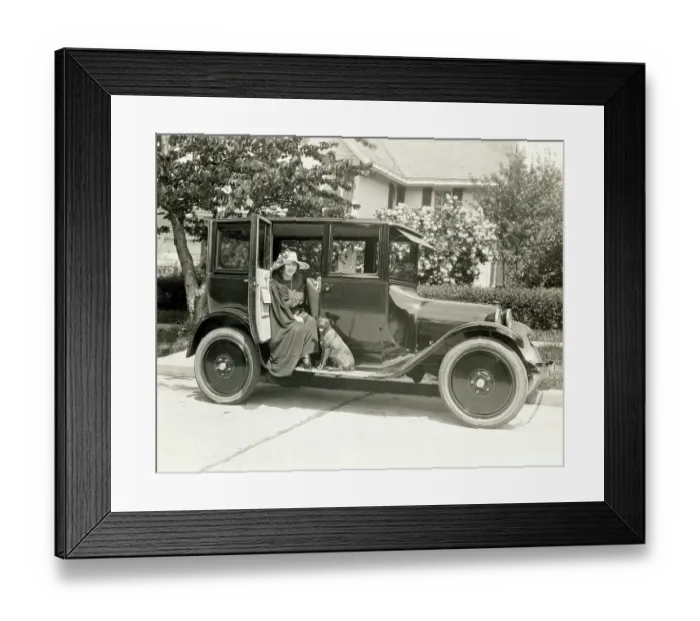 Framed Print : Woman And Dog Seated On A Dodge Outside Framed Print : Woman And Dog Seated On A Dodge Outside