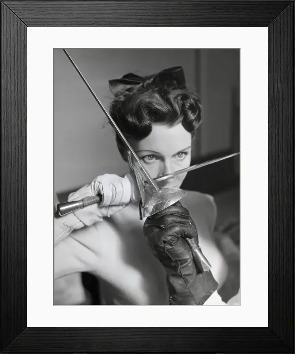 Framed Print : Woman in a Duel, Holding Foil Against Foil Framed Print : Woman in a Duel, Holding Foil Against Foil