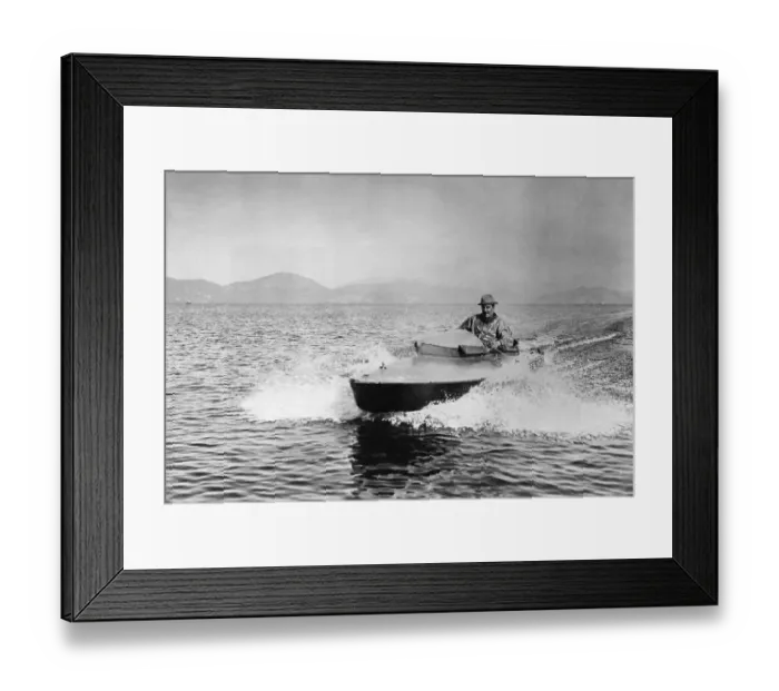 Framed Print : Puccini Piloting Motorboat Framed Print : Puccini Piloting Motorboat