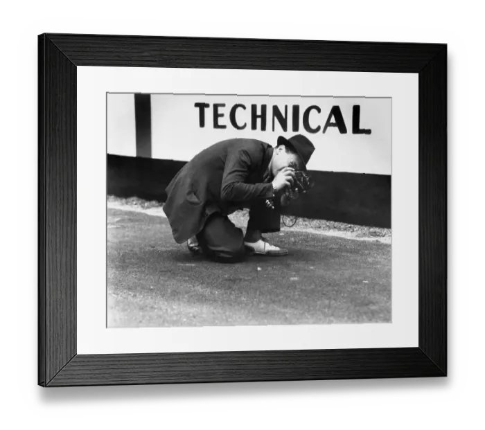 Framed Print : Crouching Photographer Framed Print : Crouching Photographer